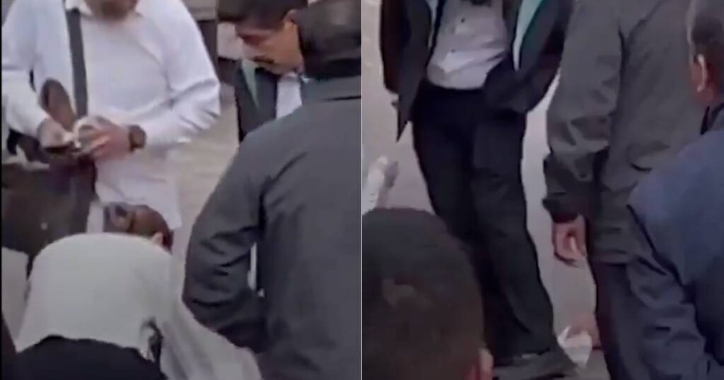 Colaboradora limpia zapatos a ministro Hugo Aguilar; él explica: ‘Se le cayó café’